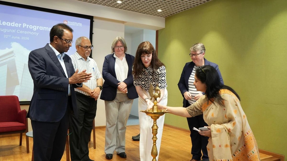 Beth Stark lighting a ceremonial lamp.