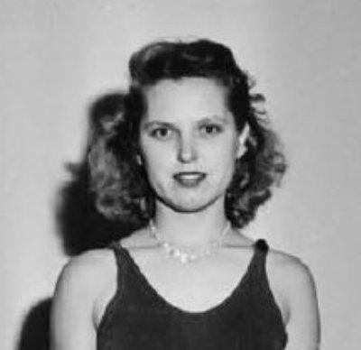 Black and white portrait photograph of Martha Skidmore, a young white woman with shoulder-length wavy hair, wearing a dark sleeveless top and a pearl necklace, looking slightly to the side with a faint smile.
